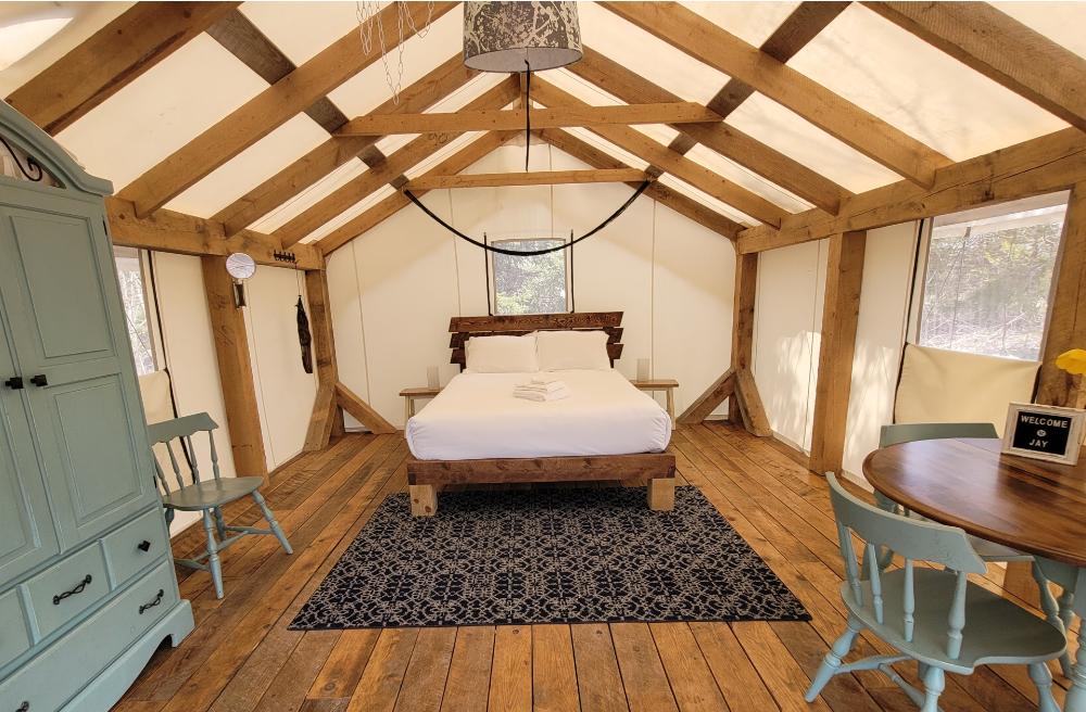 Interior of Cherry Tent with queen bed in Nova Scotia